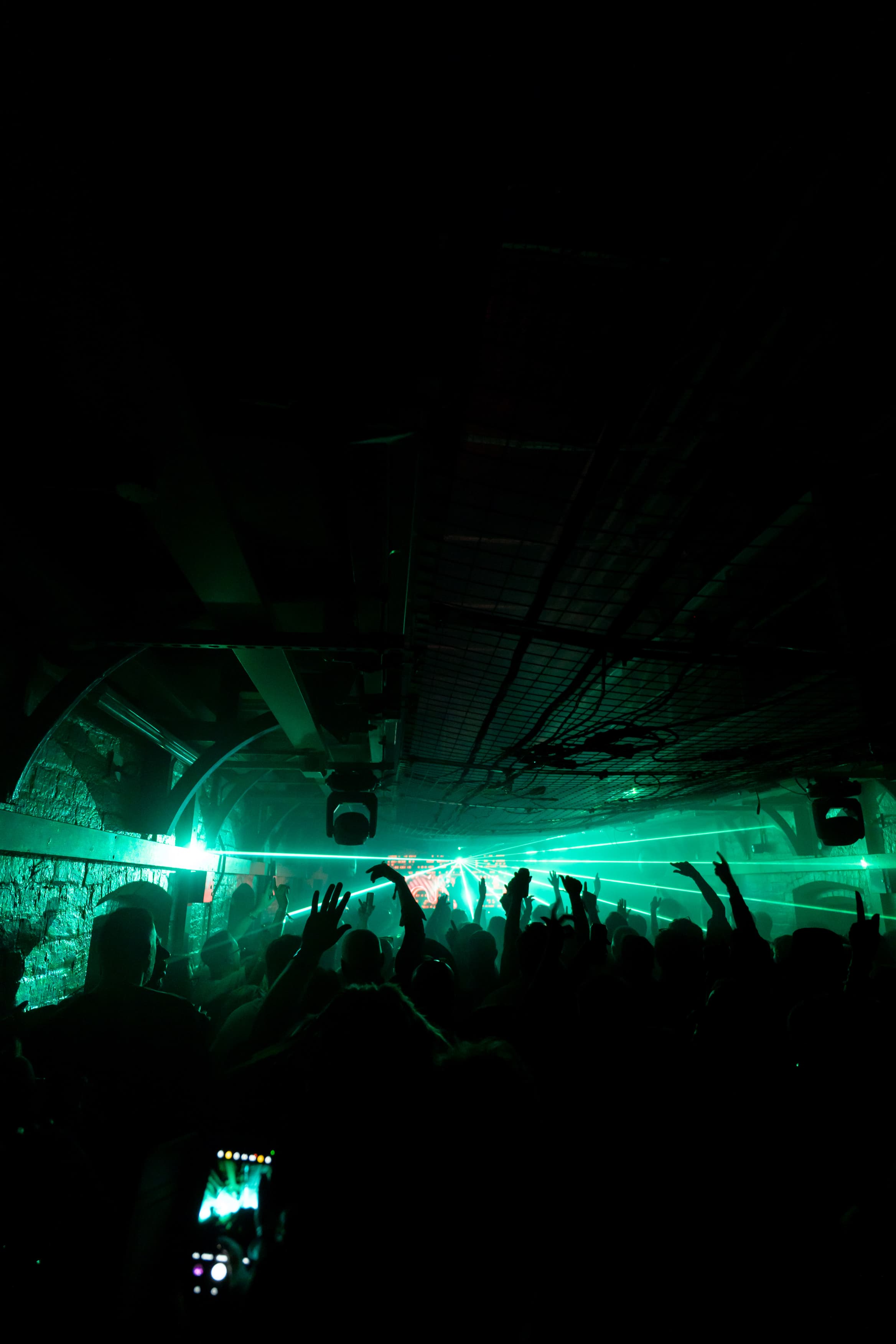 Green lasers cutting through prison wing